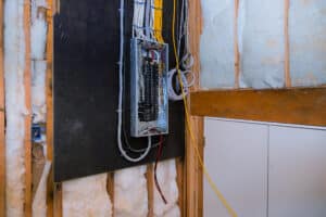 Interior of a new home under construction board connection electric system in cabinet new breakers in control box.